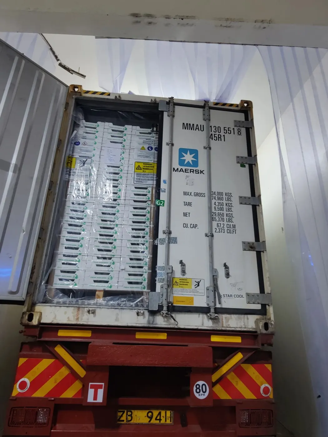 Refrigerated container with doors open at a Mombasa depot before loading